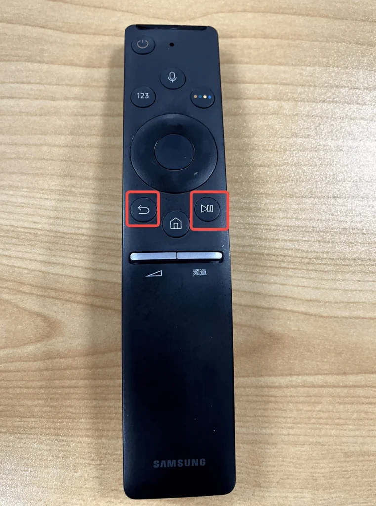 press the back and pause buttons to pair Samsung remote