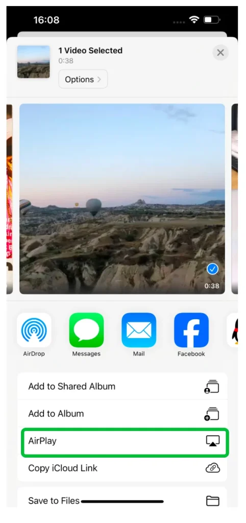 locate the AirPlay feature when browsing a video in the Photos app
